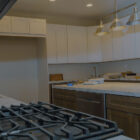 Kitchen undergoing renovation with new cabinets and countertops