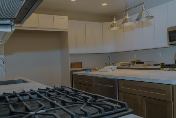 Kitchen undergoing renovation with new cabinets and countertops